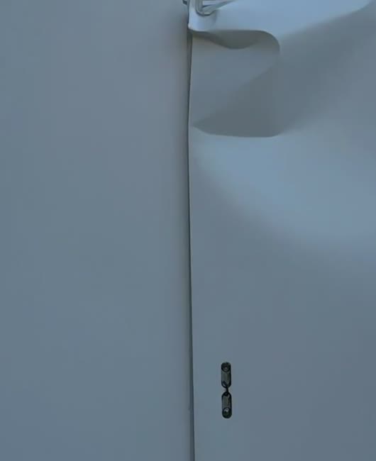 A blue-grey architectural detail and a folded surface